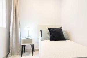 Posteľ alebo postele v izbe v ubytovaní Atarazanas FreshApartments