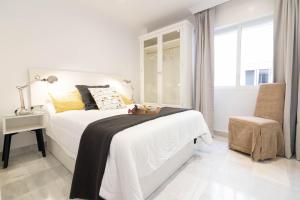 Posteľ alebo postele v izbe v ubytovaní Atarazanas FreshApartments