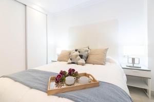 Posteľ alebo postele v izbe v ubytovaní Atarazanas FreshApartments