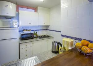 Kuchyň nebo kuchyňský kout v ubytování Apartamentos Nuevo Mexico (9º-C)