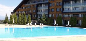 The swimming pool at or close to studio by the Pool in Aspen Heights Bansko