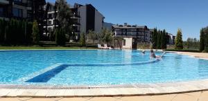 The swimming pool at or close to studio by the Pool in Aspen Heights Bansko