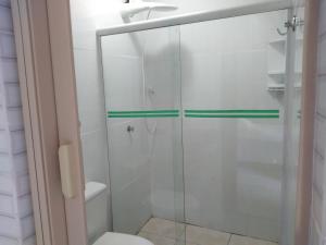 a bathroom with a glass shower with a toilet at Casa da Cacaia e do Henrique in Rio de Janeiro +129 photos