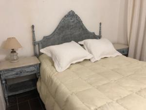 Una cama o camas en una habitación de Chalet En La Paloma A 2 De Playa Los Botes (hermosa Zona)