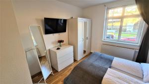 TV a/nebo společenská místnost v ubytování Apartment Blochmann-Cárre