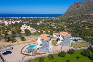 an aerial view of a villa with a swimming pool at Utopia Luxury Villas in Gouves