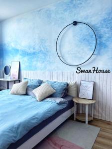 a bedroom with a large bed with a blue sky at Premium Swanhouse no.SiX with 3bedrooms Condo in Sibu