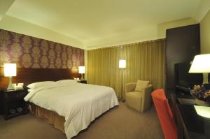 Ένα ή περισσότερα κρεβάτια σε δωμάτιο στο Delight Hotel