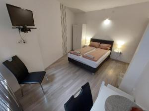 A bed or beds in a room at Palma Vendégház