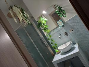 a bathroom with a shower and a toilet and plants at Salerno Inn B&B in Salerno +88 photos