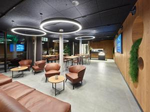 Posezení v ubytování ALPSTADT LIFESTYLE Hotel