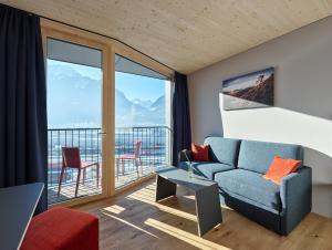 Posezení v ubytování ALPSTADT LIFESTYLE Hotel
