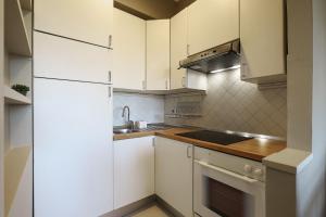 Kuchnia lub aneks kuchenny w obiekcie Contempora Apartments - Elvezia 8 - E51