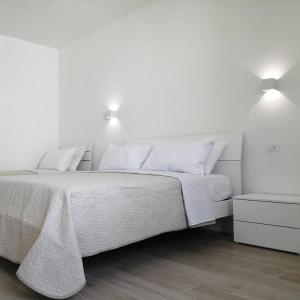 Letto o letti in una camera di AMARE Bed & Breakfast