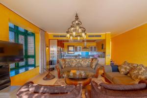 A television and/or entertainment centre at VESTA - El Gouna Residence