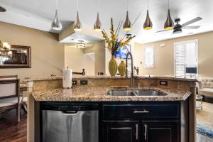 a kitchen with a sink and a counter at Luxury & Highly furnished upscale w Patio & Garage in Plano