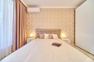 Ένα ή περισσότερα κρεβάτια σε δωμάτιο στο Premium center apartment in Grand Karavel