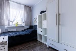 Posteľ alebo postele v izbe v ubytovaní Apartament SunForYou 2