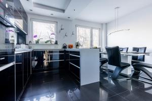 Kuchyňa alebo kuchynka v ubytovaní Apartament SunForYou 2