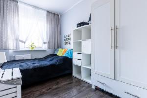 Posteľ alebo postele v izbe v ubytovaní Apartament SunForYou 2