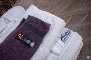a towel with a bottle of toothpaste on top of it at Flatmoen Natur Lodge in Alta