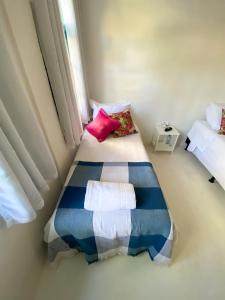 Woman Trip Hostel Boutique - Arraial d´Ajuda tesisinde bir odada yatak veya yataklar