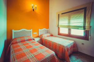 Cama o camas de una habitación en Posada Peñarubia