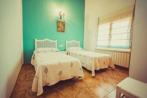 Cama o camas de una habitación en Posada Peñarubia