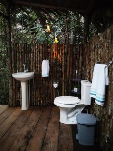 a bathroom with a sink and a toilet at Glamping Amazonas in Leticia