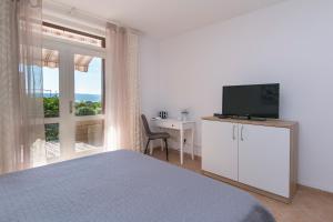 TV a/nebo společenská místnost v ubytování Seaview Center House Brela