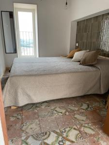 Postel nebo postele na pokoji v ubytování La Finestra su Noto