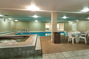 a swimming pool with a table and chairs in a building at Longbranch 317 Evergreen Condo Nice Location Updates in Breckenridge