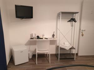 TV a/nebo společenská místnost v ubytování Residenza Tarzanà