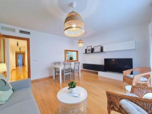 a living room with a couch and a table at Apartamentos Duque Cartagena in Cartagena