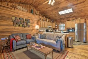 A seating area at Creekside Marietta Cabin Retreat with Fire Pit!