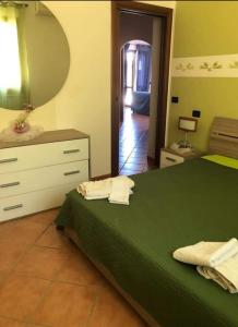 Posteľ alebo postele v izbe v ubytovaní Appartamento in villa vita + 11 fotografií