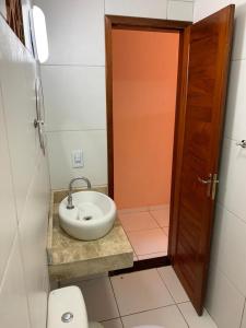 Ein Badezimmer in der Unterkunft Chalé do Aldo