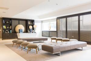 a living room with couches and chairs at Clayton Hotel Burlington Road in Dublin