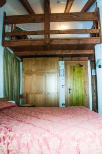 Postel nebo postele na pokoji v ubytování Hotel Vallée De Cogne