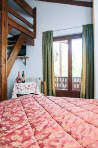 Postel nebo postele na pokoji v ubytování Hotel Vallée De Cogne