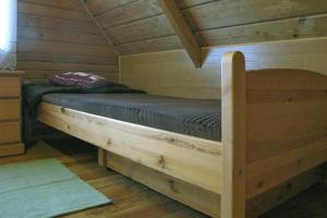 Postel nebo postele na pokoji v ubytování Wooden House by Masurian Lakes Gizycko
