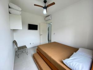 Ein Bett oder Betten in einem Zimmer der Unterkunft Apartamento com excelente localização e conforto!