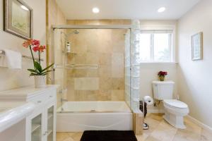 a bathroom with a shower and a tub and a toilet at Sonoma Wine Country Bungalow in Sonoma