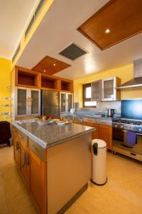A kitchen or kitchenette at VESTA - El Gouna Residence