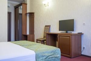 Cama o camas de una habitación en Avrora Hotel