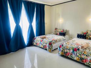Ένα ή περισσότερα κρεβάτια σε δωμάτιο στο Bentrina Diving Resort