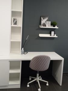 an office with a white desk and a chair at NY Central 1 in Patra +3 photos