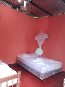 Giường trong phòng chung tại Hospedaje la paloma