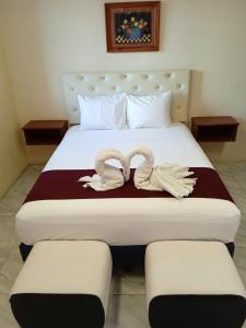 Tempat tidur dalam kamar di Hotel Bugambilia Campeche
