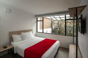 Postel nebo postele na pokoji v ubytování Urbano Luxury Hotel